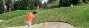 Golf Club de Courchevel | ©Léo RIVOIRON, golf player making a bunker shot