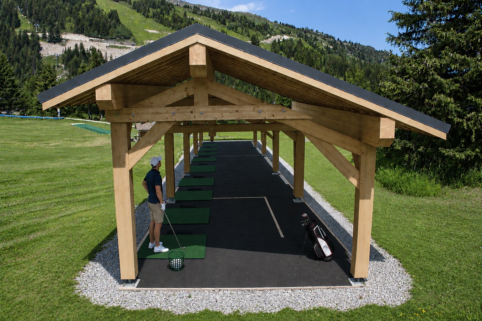 Covered practice area at the Courchevel Golf Club with training stations overlooking the Alpine mountains.